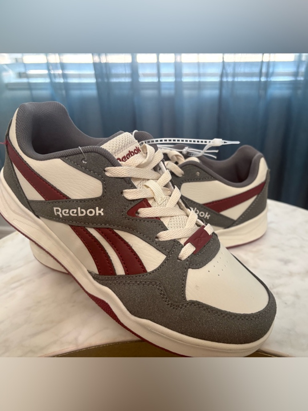 Reebok Royal BB4500 Low 2 sneakers in a Grey / Maroon / White colorway.